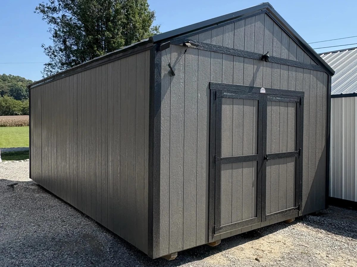Gray driftwood woodgrain-finish shed with black doors and trim