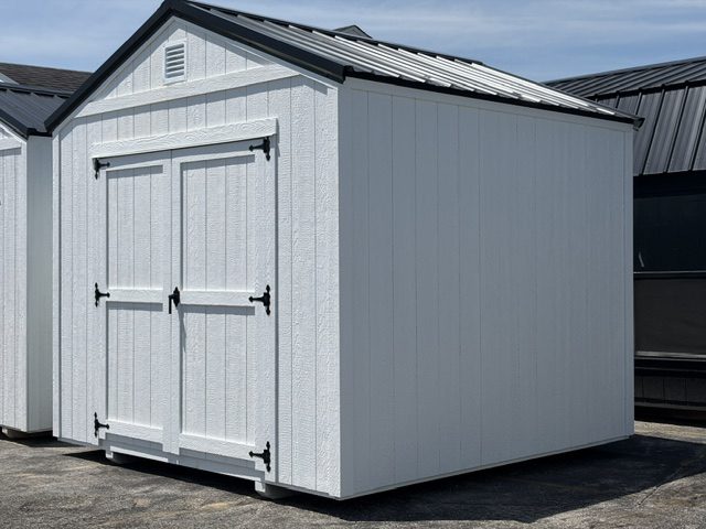 Small white gable shed with plain panel double doors