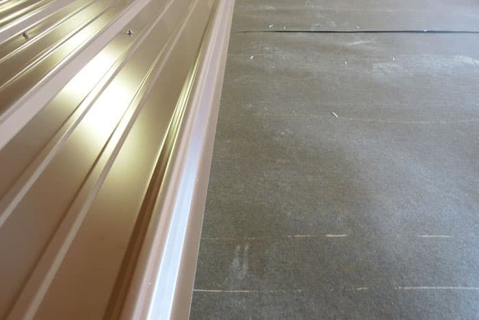 metal with tar paper on a quality metal shed roof