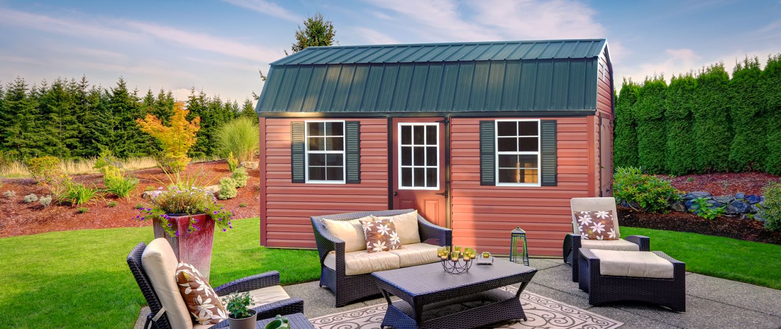 A red shed in Kentucky with vinyl siding and a loft
